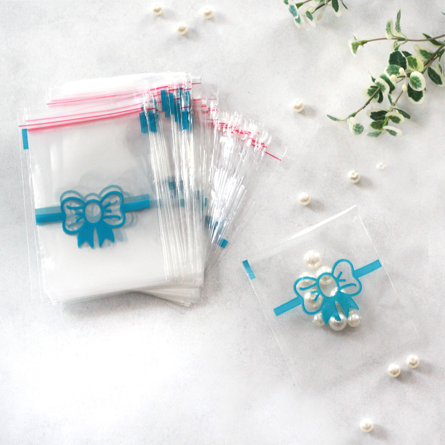 100 adet mavi fiyonk desenli bantlı şeffaf poşet / 10x15 cm - 2